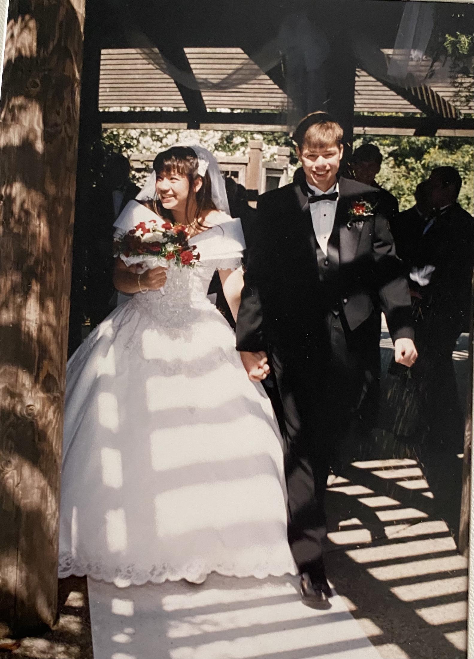 Bride and groom under the gazebo